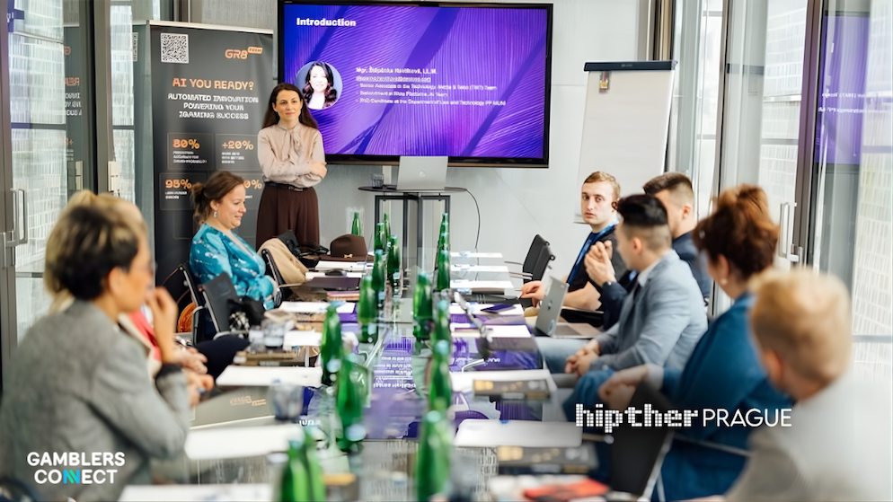 HIPTHER Prague Summit 2026 showing attendees engaged in AI capability training.