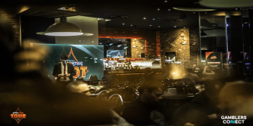 Interior view of the PartyPoker Tour Day 3 at Genting Casino Sheffield, showing the tournament area and official event branding.
