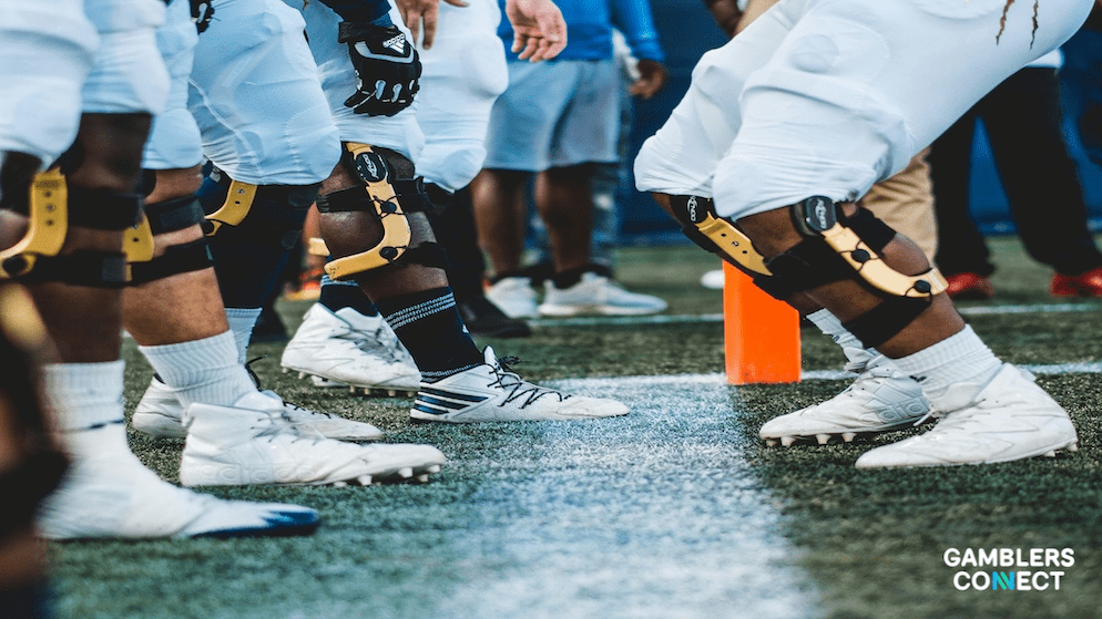 A professional football on a turf field, representing the Super Bowl LX and the much-awaited coin toss.