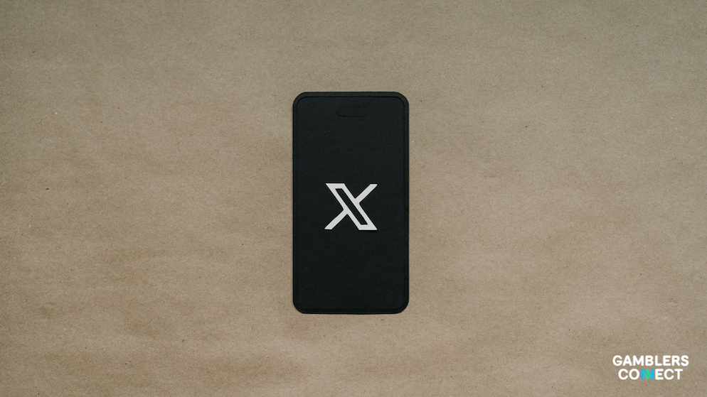 Digital compliance symbol for X's updated commercial content rules regarding prohibited gambling industries.