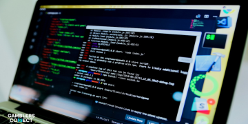 A high-resolution close-up of a laptop screen displaying complex lines of code and terminal logs, representing the $4.3M BC.GAME exploit.