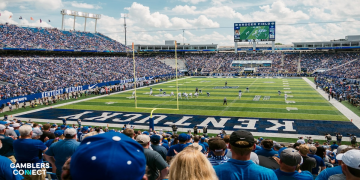 A high-angle shot of a stadium with "KENTUCKY" written in the end zone and "KENTUCKY WILDCATS" on the sidelines.