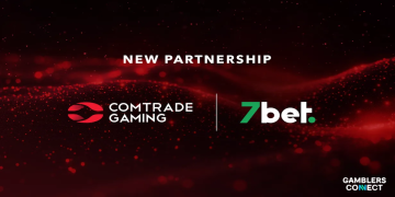 An official corporate partnership graphic displaying a dark red background with glowing digital particle waves, showcasing the white text logo of Comtrade Gaming on the left and the green and white logo of 7bet on the right, separated by a thin white vertical divider line beneath the text New Partnership.