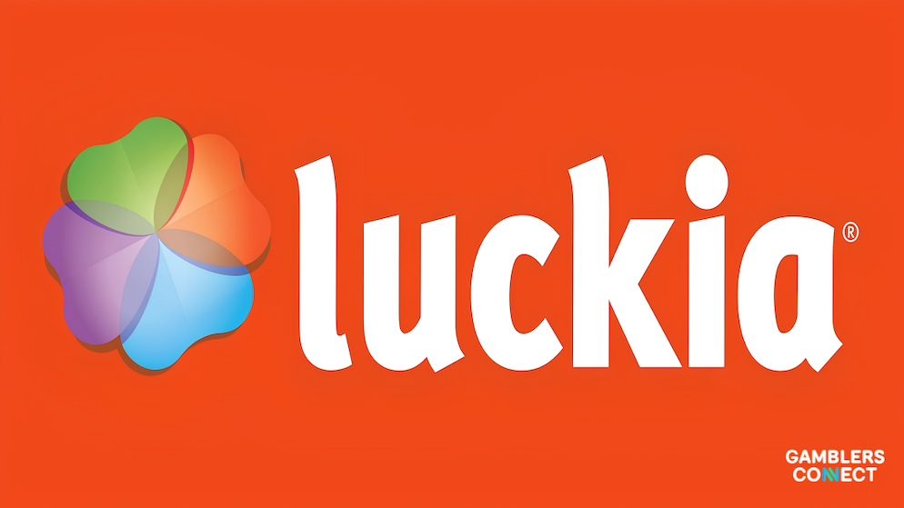 The high-contrast orange corporate branding identity of Spanish B2C gaming operator Luckia showcased over a flat color canvas backdrop layout.