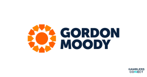 The crisp corporate branding logo of Gordon Moody, showcasing an orange multi-pointed star emblem placed to the left of the charity name written in dark blue typography on a white background.