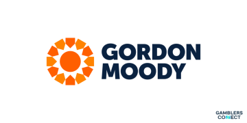 The crisp corporate branding logo of Gordon Moody, showcasing an orange multi-pointed star emblem placed to the left of the charity name written in dark blue typography on a white background.