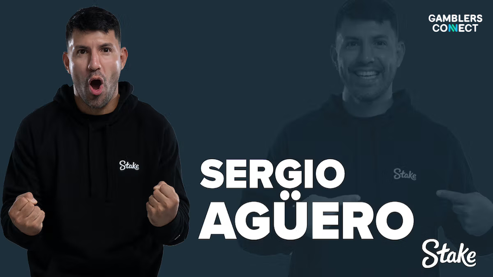 A promotional marketing graphic from Stake featuring a high-contrast studio portrait of legendary Argentinian football star Sergio Agüero wearing a black hoodie with a white Stake logo, shouting excitedly with clenched fists next to his name displayed in bold white typography.