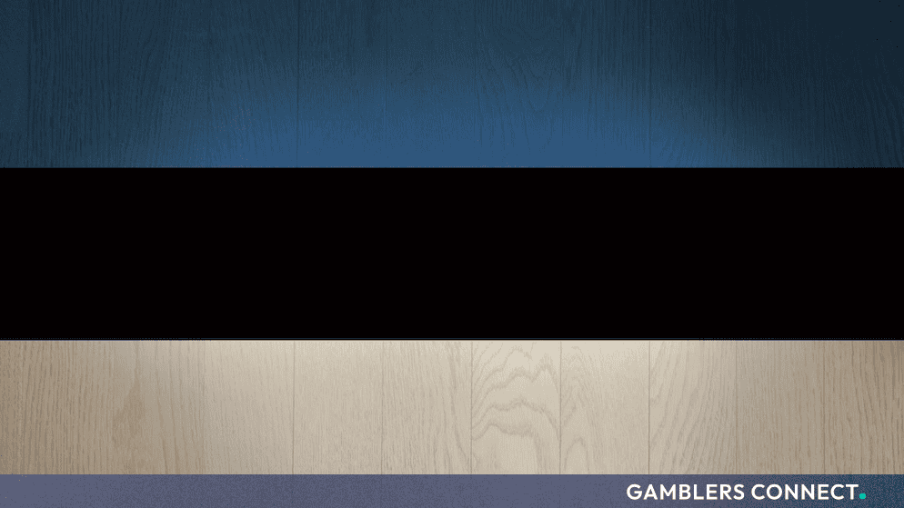 The national flag of Estonia displayed on a wooden textured background, representing regulatory updates in the country.
