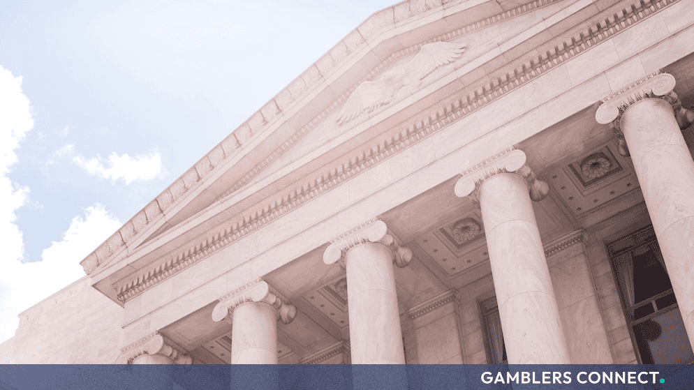 Detailed architecture shot focusing on the stone pillars and facade of a classic regulatory institution.