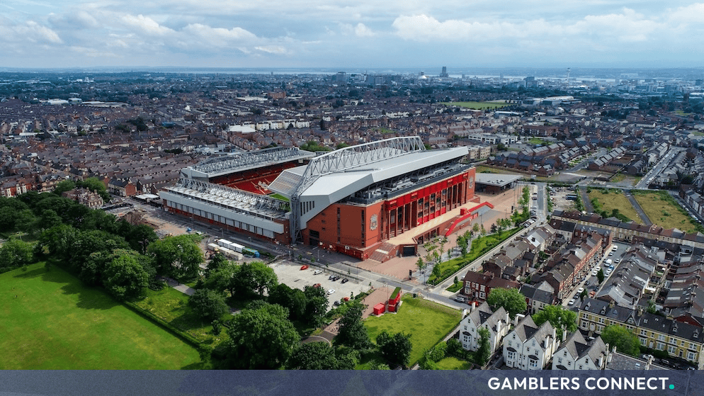Amit Bhatia-Led Consortium in Talks to Acquire Minority Stake in Liverpool FC 1 High-angle shot of Anfield Stadium, home ground of Liverpool Football Club.