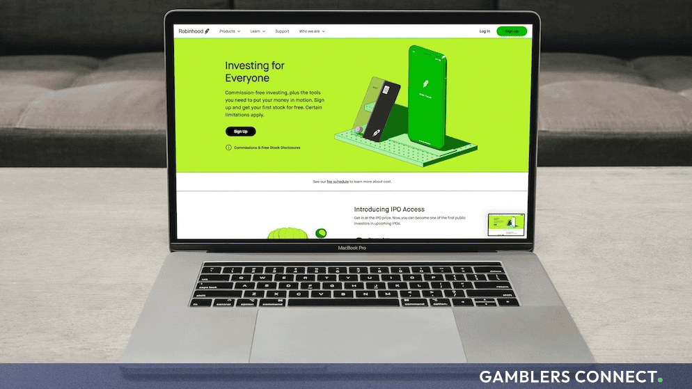 A close-up view of a laptop screen displaying the commission-free investment platform interface for Robinhood, illustrating user onboarding into digital asset classes.