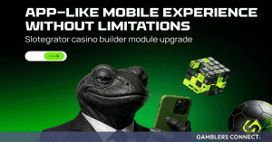 A dark green promotional graphic. On the left is a 3D model of a black toad wearing a formal suit and tie, holding a green smartphone in its leather-gloved hands. Above the character, the white text reads "APP-LIKE MOBILE EXPERIENCE WITHOUT LIMITATIONS" and "Slotegrator casino builder module upgrade". On the right, a stylized green and black Rubik's cube and a black and green soccer ball float in the air.