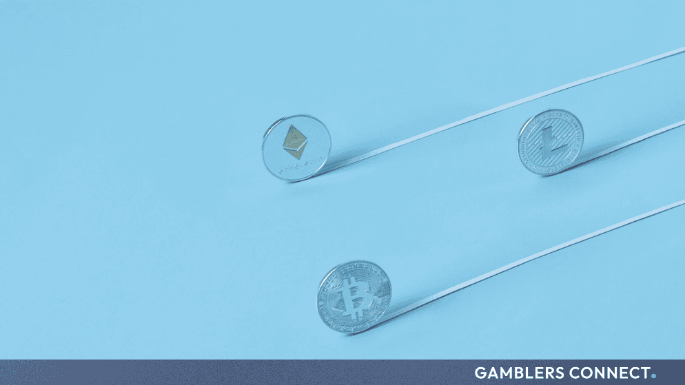 Silver Bitcoin and altcoin tokens positioned on a clean blue background, symbolizing capital flows and spot market asset consolidation.