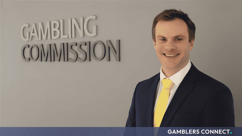 UKGC Executive Director of Policy & Research Tim Miller to Step Down After a Decade of Service 1 Professional headshot of UKGC Executive Tim Miller positioned in front of the official Gambling Commission corporate office branding backdrop.