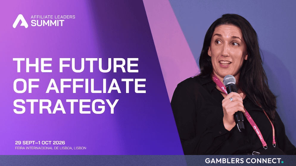 A conference speaker holding a microphone during a panel session at the Affiliate Leaders Summit, displayed alongside event branding for the 2026 Lisbon summit.