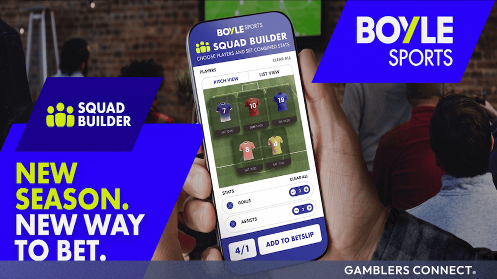 A person holding a smartphone displaying the BOYLE Sports Squad Builder mobile interface with pitch view graphics and stat options.
