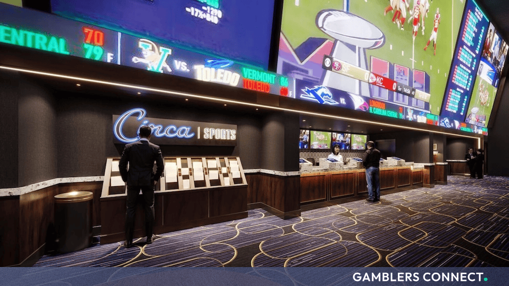 Interior view of a Circa Sports retail sportsbook featuring betting windows and large digital odds screens.