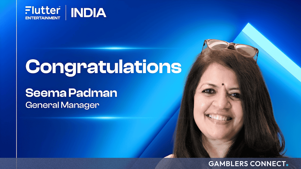 Professional corporate portrait of Seema Padman against a blue promotional backdrop featuring the Flutter Entertainment India branding.