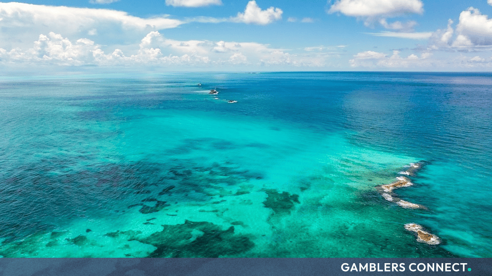 Crystal-clear turquoise waters and coral reefs in the Bahamas, representing the scenic backdrop of the WSOP Paradise winter festival at Baha Mar.