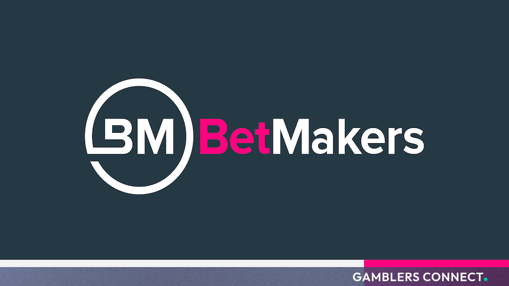 Official BetMakers corporate logo displayed against a dark navy background with a pink accent stripe.