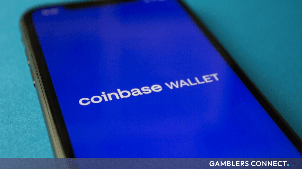 Smartphone display showing the Coinbase Wallet application interface against a blue background.