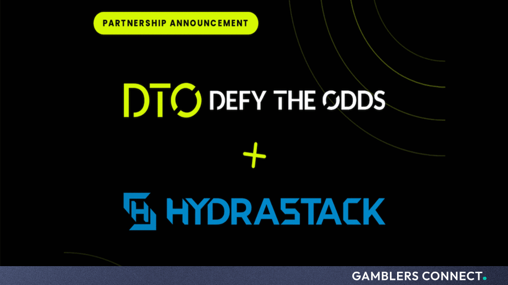 Official partnership announcement graphic featuring the DTO Defy the Odds and Hydrastack logos against a dark background.