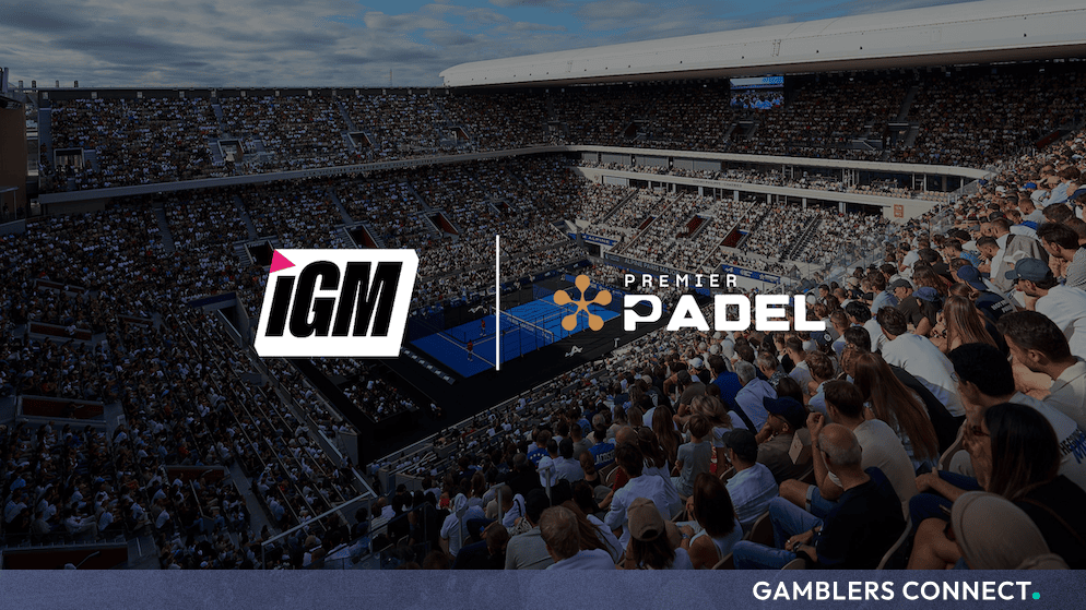 Panoramic view of a packed stadium hosting a professional Premier Padel tournament alongside partner branding logos.