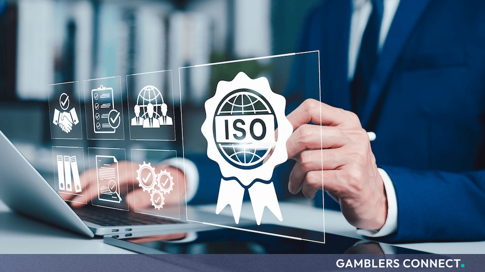 A corporate professional interacting with a digital ISO certification graphic on a laptop.
