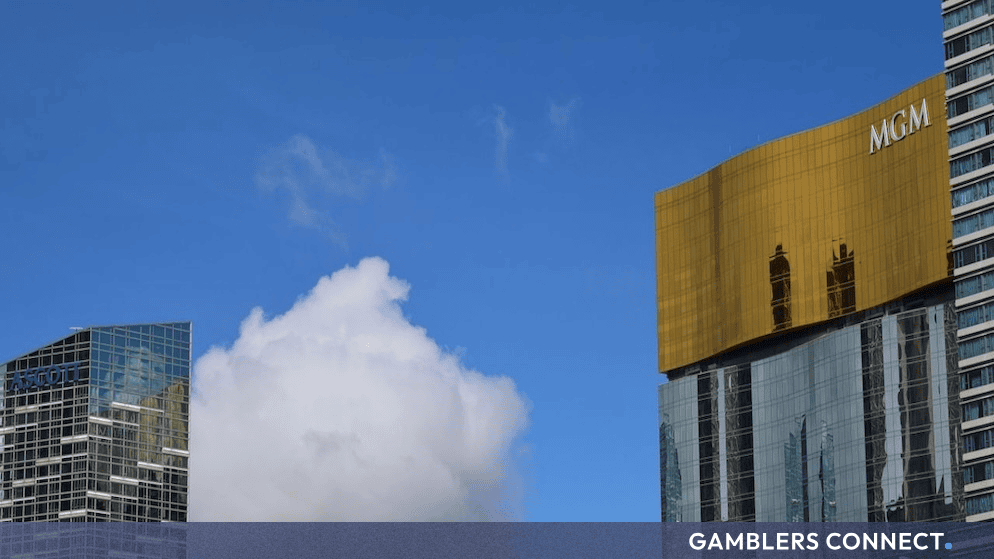 Exterior view of modern high-rise buildings in Las Vegas under a bright blue sky, featuring the MGM branding.