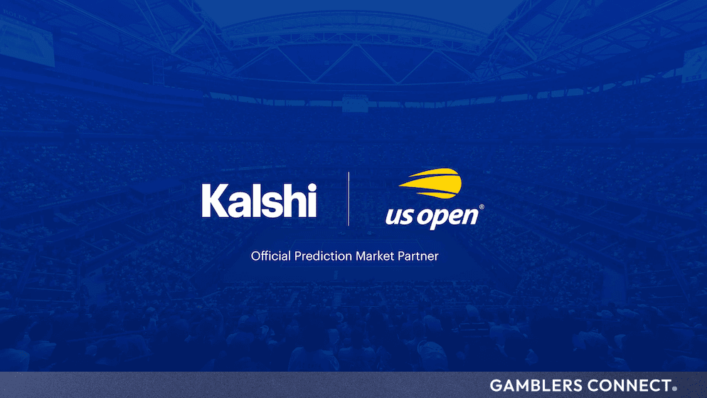 A professional tennis court at the US Open showcasing tournament branding and packed grandstands under bright lights.