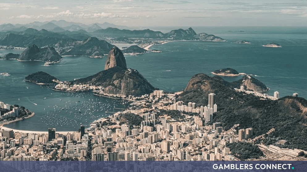 Panoramic view of Rio de Janeiro coastline, mountains, and urban landscape in Brazil.