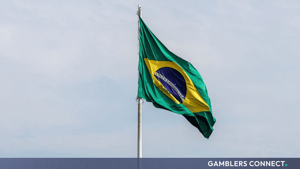 Brazilian national flag waving against a clear sky representing Supreme Court legal deliberations on sports betting