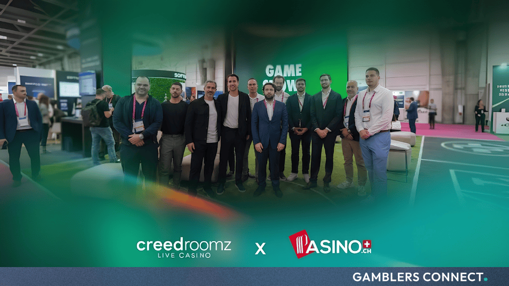 Representatives from SoftConstruct and PASINO.ch celebrating their partnership announcement at SBC Summit Lisbon 2026 with CreedRoomz and PASINO.ch branding.
