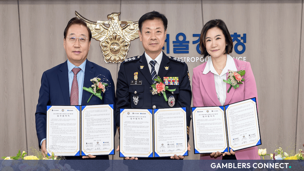 Official representatives holding signed agreements during a South Korean police and banking partnership meeting for youth protection